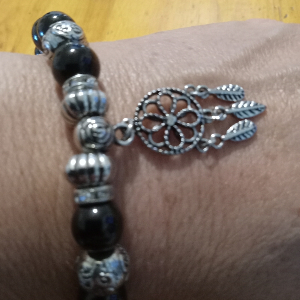 Black and Silver Colored Bracelet with Ornate Design. Stretch